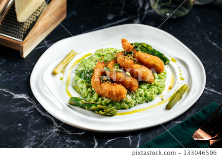Green risotto with fried shrimp and asparagus Green risotto with fried shrimp and asparagus 133046596