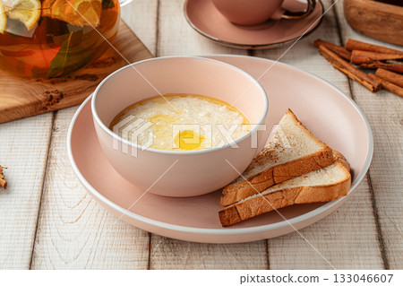 Rice porridge with butter and toast 133046607