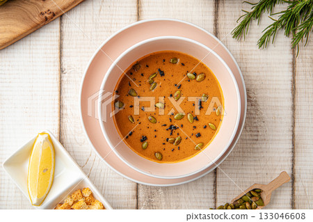 Lentil soup with seeds and croutons 133046608