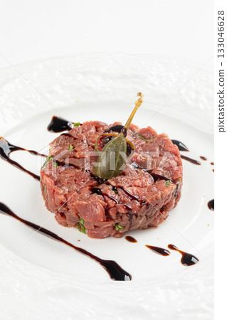Portion of beef tartare with caper and sauce Portion of beef tartare with caper and sauce 133046628