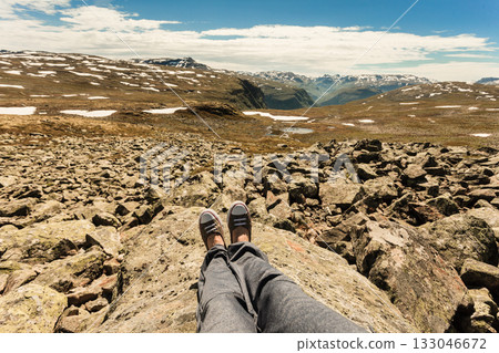Human legs and mountains landscape in Norway. Human legs and mountains landscape in Norway. 133046672