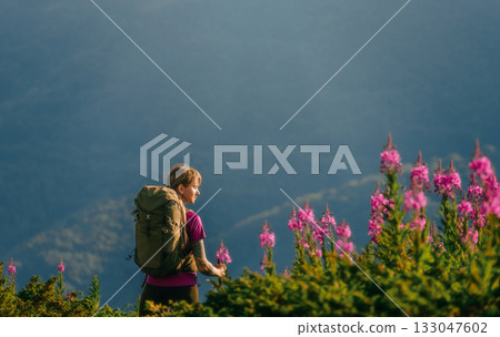 Woman with Tourist Backpack Hiking in Mountains Woman with Tourist Backpack Hiking in Mountains 133047602