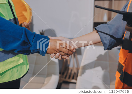 Architects and engineers working collaboratively on construction project Architects and engineers working collaboratively on construction project 133047656