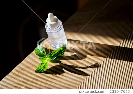 Natural mint essence dropper bottle healthcare concept Natural mint essence dropper bottle healthcare concept 133047663