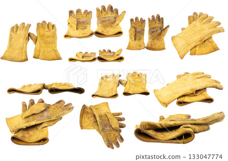 Yellow work gloves Dirty Old isolated on white background Yellow work gloves Dirty Old isolated on white background 133047774