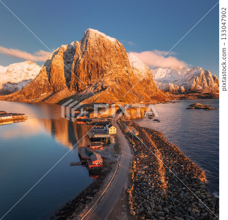 Aerial view of the road in Hamnoy village at sunrise in winter Aerial view of the road in Hamnoy village at sunrise in winter 133047902