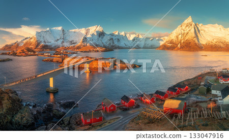 Aerial view of bridge and red fishing rorbu in Lofoten Islands 133047916