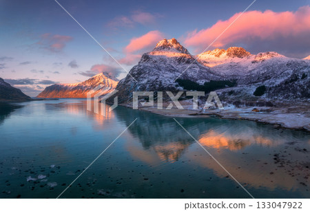 Scenic winter aerial view of snow-covered mountains and sea Scenic winter aerial view of snow-covered mountains and sea 133047922