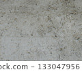 Gray rough solid hard background of hardened concrete or mortar as a full-frame texture with empty copy space, graphic resource of a monochromatic gray surface with uneven relief 133047956