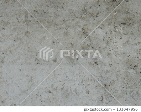 Gray rough solid hard background of hardened concrete or mortar as a full-frame texture with empty copy space, graphic resource of a monochromatic gray surface with uneven relief 133047956