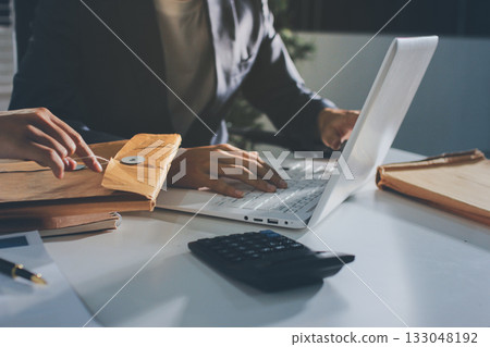 Lawyer explained to the client about the law that must be brought against the court case. Lawyer explained to the client about the law that must be brought against the court case. 133048192