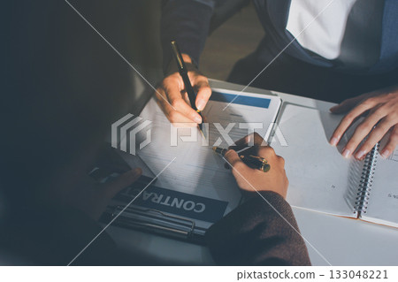 Lawyer explained to the client about the law that must be brought against the court case. Lawyer explained to the client about the law that must be brought against the court case. 133048221