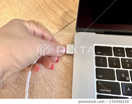 Charging a work laptop, charger 133048250