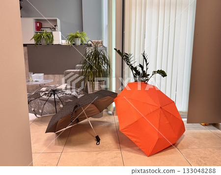 Colorful umbrellas in the office lobby Colorful umbrellas in the office lobby 133048288