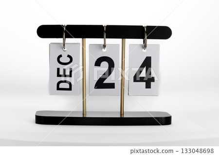 This perpetual desk calendar displays the current date of December 24th This perpetual desk calendar displays the current date of December 24th 133048698