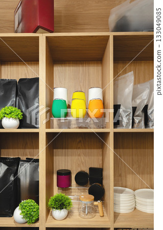 Colorful jars and organized shelves in a modern kitchen storage area Colorful jars and organized shelves in a modern kitchen storage area 133049085