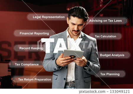 Professional advisor reviewing tax-related tasks in an office setting during the day 133049121