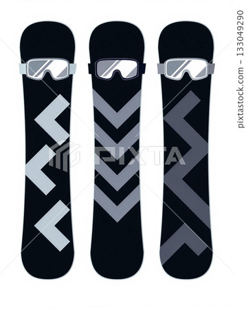 Snowboard designs featuring bold graphics and protective goggles for winter sports enthusiasts at a snowy mountain resort 133049290