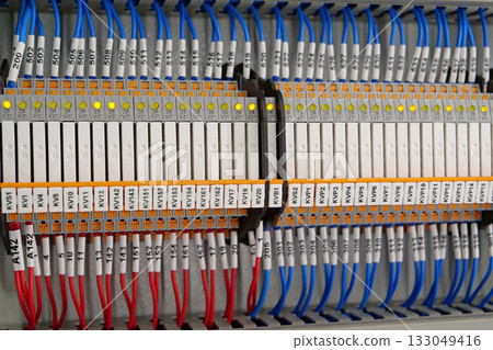Terminal blocks in electrical cabinet.Industrial electrical equipment and wiring Terminal blocks in electrical cabinet.Industrial electrical equipment and wiring 133049416