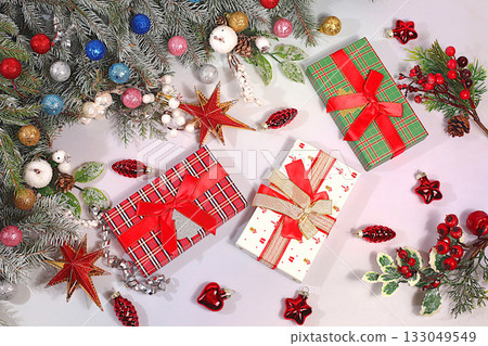 Holiday gift boxes on festive background with Christmas decorations, New Year sales and shopping concept, Black Friday, store promotion banner and screen template Holiday gift boxes on festive background with Christmas decorations, New Year sales and shopping concept, Black Friday, store promotion banner and screen template 133049549