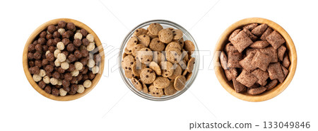 Assorted breakfast cereal piles isolated. Corn flakes mix, various granola food Assorted breakfast cereal piles isolated. Corn flakes mix, various granola food 133049846