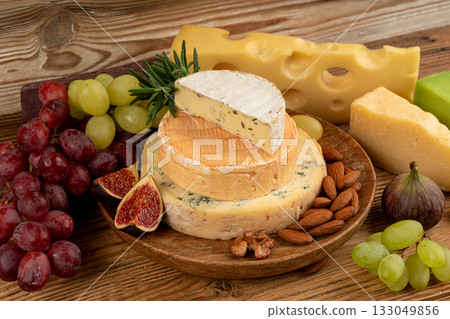 Cheese plate of color cheeses variety, yellow, white and blue cheese board, assorted dairy products 133049856