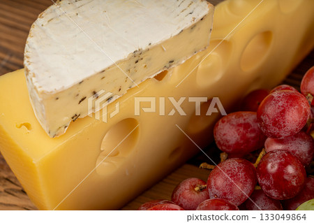 Cheese plate of color cheeses variety, yellow, Maasdam cheese board, assorted dairy products 133049864