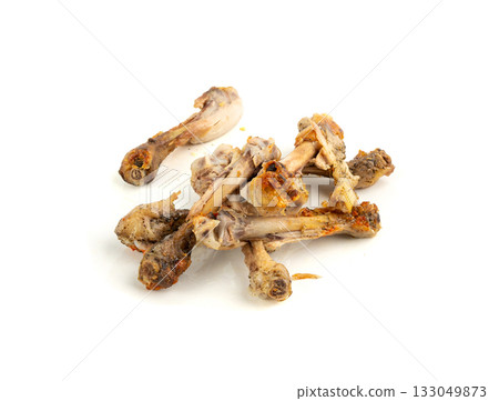 Chicken Leftovers, Unfinished Grilled Chicken on Dirty Plate Isolated, Meat Pieces and Bones after Dinner 133049873