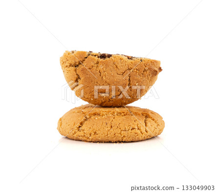 Chocolate cookies with chocolate filling isolated, brown round biscuits, broken sweet cocoa pastry 133049903