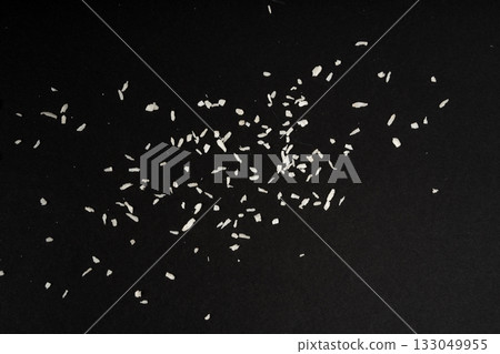 Grated coconut powder. Dry coco flakes pile, shredded desiccated coconut, tropical fruit chips Grated coconut powder. Dry coco flakes pile, shredded desiccated coconut, tropical fruit chips 133049955