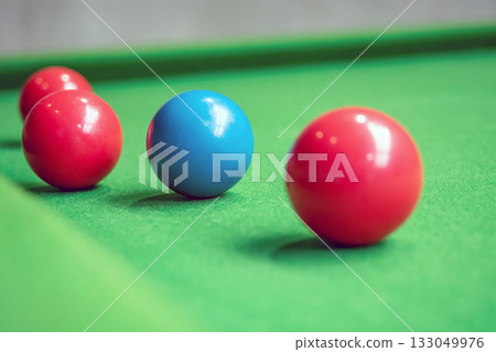 Close up Snooker balls on a green table focus on blue Close up Snooker balls on a green table focus on blue 133049976
