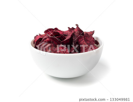 Dry beetroot chips isolated, dried sliced red beet flakes pile, beet root pieces and chips Dry beetroot chips isolated, dried sliced red beet flakes pile, beet root pieces and chips 133049981