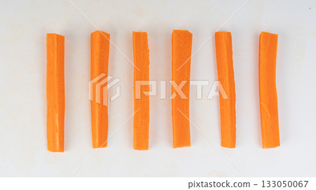 Carrot sticks, long pieces of fresh vegetables ready to eat Carrot sticks, long pieces of fresh vegetables ready to eat 133050067