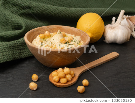 Hummus in bowl, houmous dip, chickpea humus tahini sauce, middle eastern spread 133050180