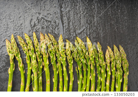 Bunch of Raw Garden Asparagus Textured Background. Fresh Green Spring Vegetables 133050203