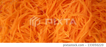 Fresh Finely Grated Carrots Textured Background, Raw Carrot Pieces Closeup Pattern 133050220