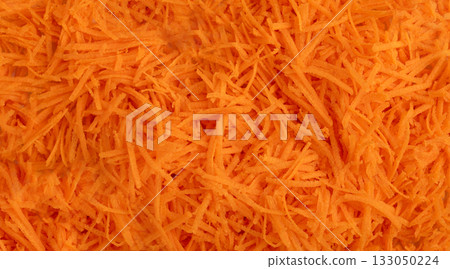 Fresh Finely Grated Carrots Textured Background, Raw Carrot Pieces Closeup Pattern 133050224
