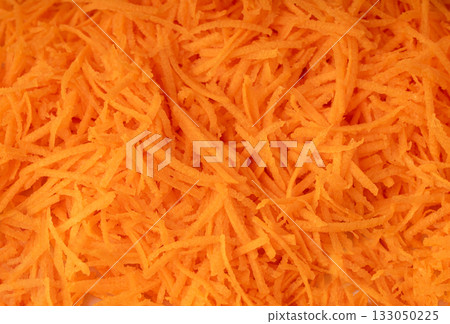 Fresh Finely Grated Carrots Textured Background, Raw Carrot Pieces Closeup Pattern 133050225