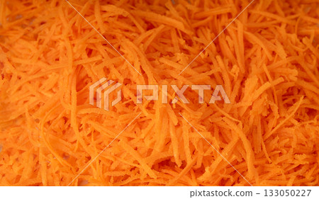 Fresh Finely Grated Carrots Textured Background, Raw Carrot Pieces Closeup Pattern 133050227