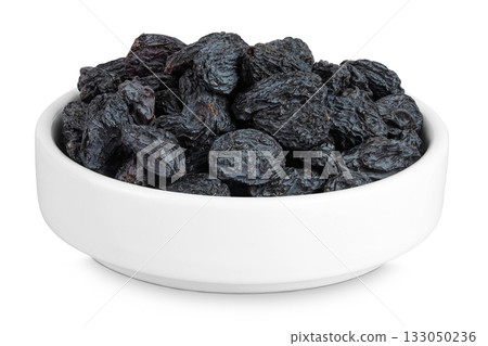 black raisins in ceramic bowl isolated on white background black raisins in ceramic bowl isolated on white background 133050236