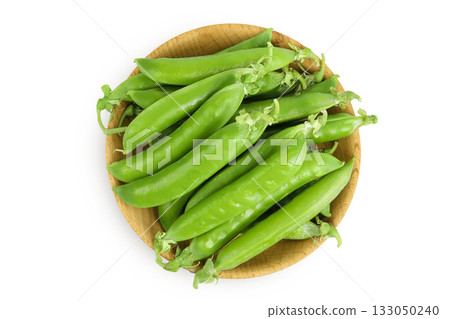 Fresh green peas fresh peas in pods in a wooden bowl isolated on white background. Top view. Flat lay Fresh green peas fresh peas in pods in a wooden bowl isolated on white background. Top view. Flat lay 133050240