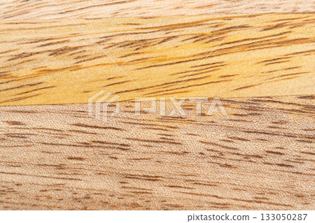 Mango wood texture top view. Kitchen wooden tray background, organic Mangifera indica veneer Mango wood texture top view. Kitchen wooden tray background, organic Mangifera indica veneer 133050287