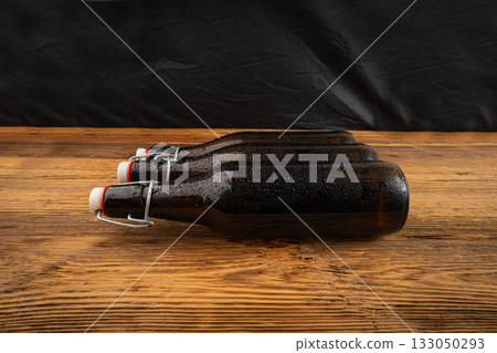 Old beer bottle, brown glass vintage beerbottle, a quality traditional time-tested drink symbol 133050293
