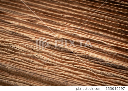 Old wood textured background. Dark driftwood surface, burnt wood brushing, macro brown floor Old wood textured background. Dark driftwood surface, burnt wood brushing, macro brown floor 133050297