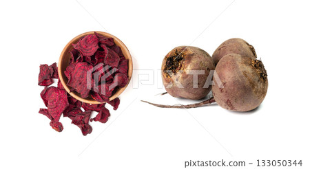 Dry beetroot chips isolated, dried sliced red beet flakes pile, beet root pieces and chips 133050344