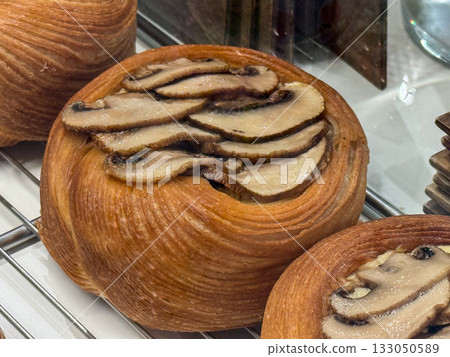 Mushroom Danish pastry with golden crust. Earthy aroma, texture harmony, and refined minimalism in bakery art. Mushroom Danish pastry with golden crust. Earthy aroma, texture harmony, and refined minimalism in bakery art. 133050589