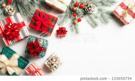 Red and green Christmas background with presents and fir branches 133050734