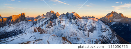 Panorama of the Dolomites mountains during autumn sunrise. Beautiful mountians of Alpi Dolomiti in Italy, South Tirol Panorama of the Dolomites mountains during autumn sunrise. Beautiful mountians of Alpi Dolomiti in Italy, South Tirol 133050753