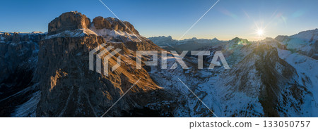 Panorama of the Dolomites mountains during autumn sunrise. Beautiful mountians of Alpi Dolomiti in Italy, South Tirol Panorama of the Dolomites mountains during autumn sunrise. Beautiful mountians of Alpi Dolomiti in Italy, South Tirol 133050757