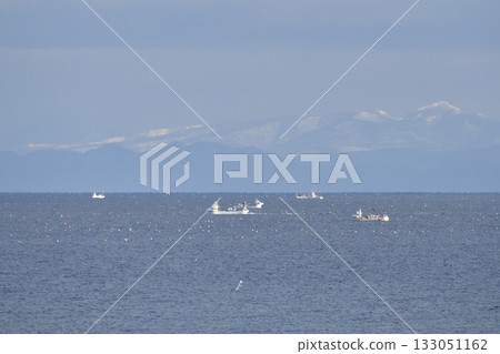 Photographed a scene of scallop fishing boats operating in Funka Bay in Yakumo Town, Hokkaido in early winter. Photographed a scene of scallop fishing boats operating in Funka Bay in Yakumo Town, Hokkaido in early winter. 133051162
